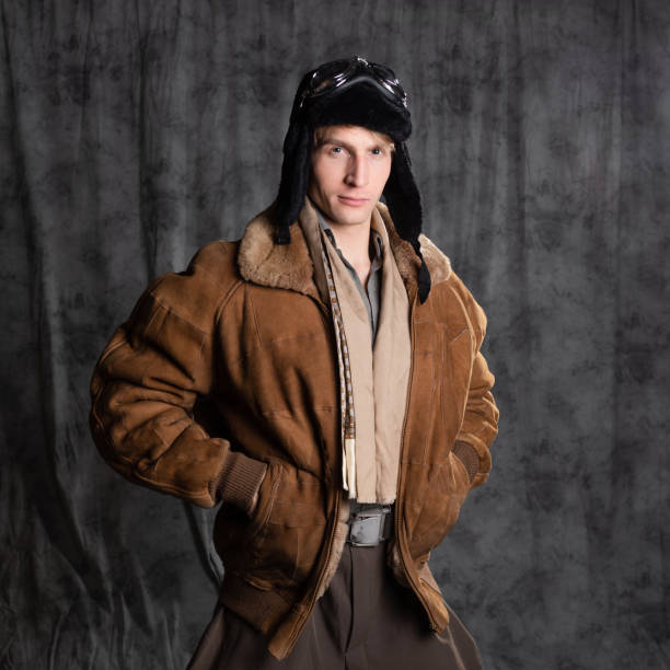 istock Pilot aviator in retro style, a young man in a flight jacket and glasses, 1337875209
