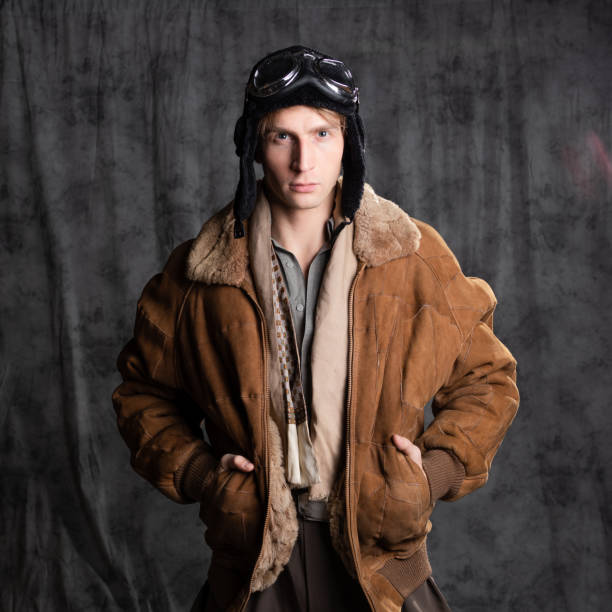 istock Pilot aviator in retro style, a young man in a flight jacket and glasses, 1337875228