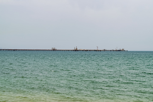 View of an oil pipeline and a dock for oil tankers.