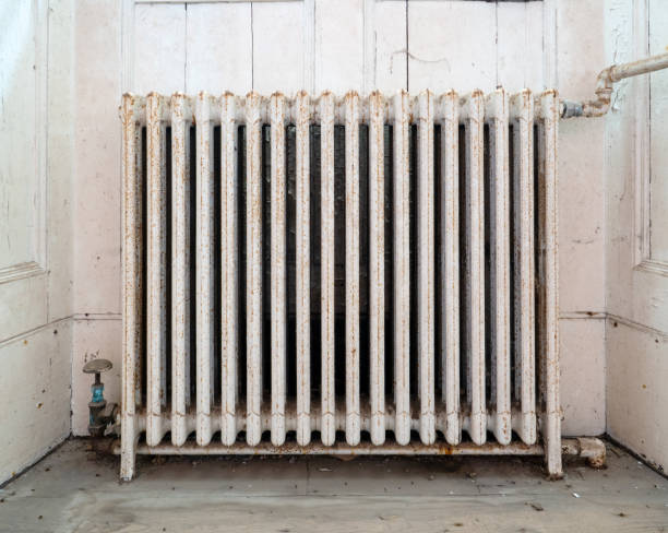 istock Old, cast iron radiator in abandoned house. 1337883461