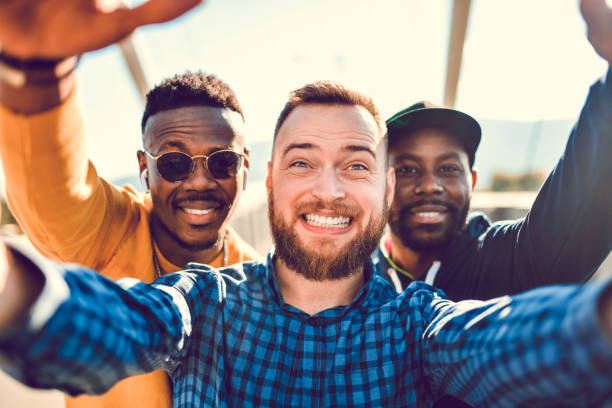 istock Smiling Selfie By Multiethnic Friends Outside 1337887738