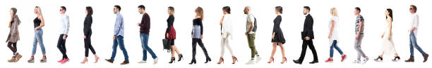 Side view of diverse group of people in casual or business clothing walking in a line. Side view of diverse group of people in casual or business clothing walking in a line. Full body length people isolated on white background people walking stock pictures, royalty-free photos & images