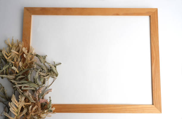 White paper in a light wooden frame. Mockup.