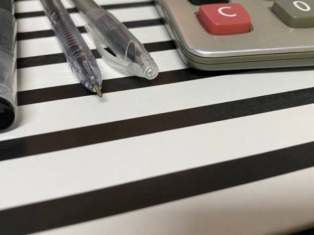 istock Top view of black and white stripe clipboard and office objects. 1337897247