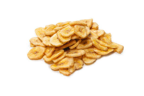 istock Banana chips isolated on a white background. Dehydrated banana. 1337899358