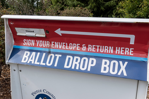 Tacoma, WA USA - circa August 2021: Close up of a Ballot Drop Box outside of a police station in downtown Tacoma.