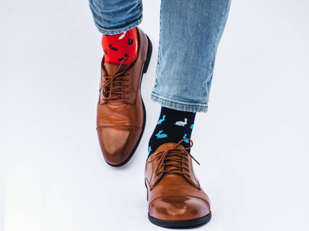 istock Men's legs, trendy shoes and bright socks 1337904784