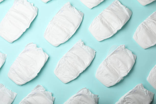 istock Flat lay composition with baby diapers on light blue background 1337906454