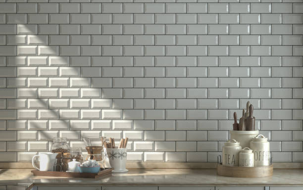 istock Warm morning kitchen scene, marble worktop various kitchenware on it with sunshine, white ceramic alternating tiles wall 3d rendering 1337907240
