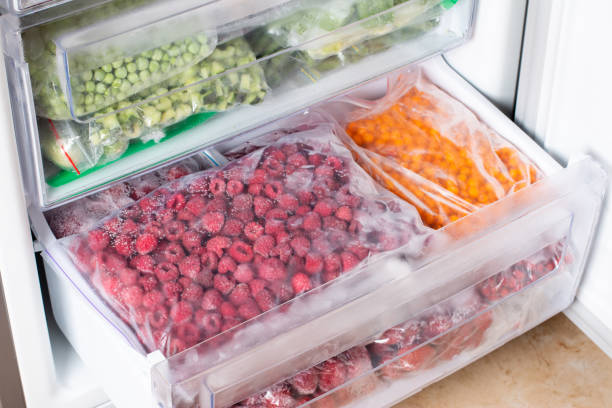 istock Frozen raspberries in the freezer. Frozen berries. 1337909175