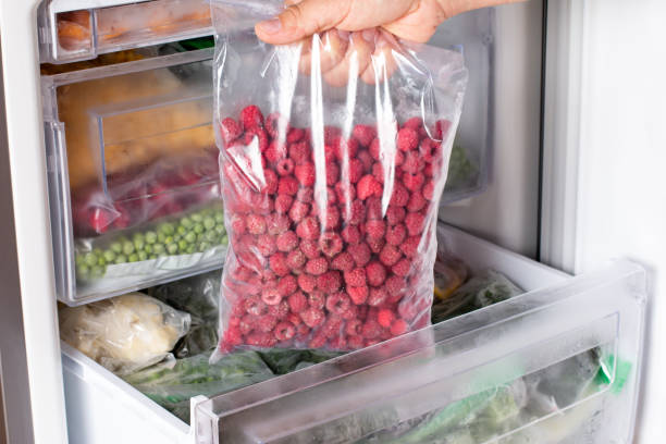istock Frozen raspberries in the freezer. Frozen berries. 1337909281