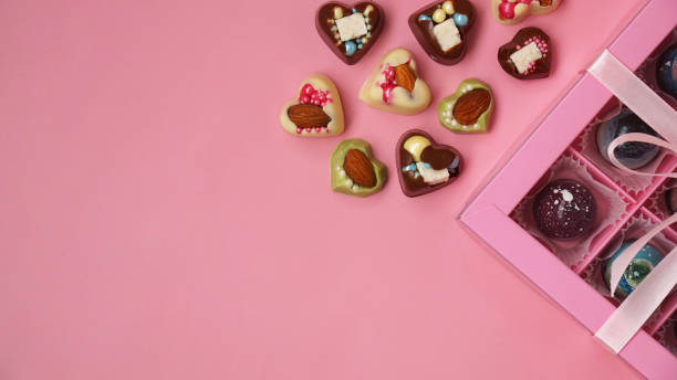 istock Chocolate candy. Pink gift box with handmade chocolates on pink 1337909415