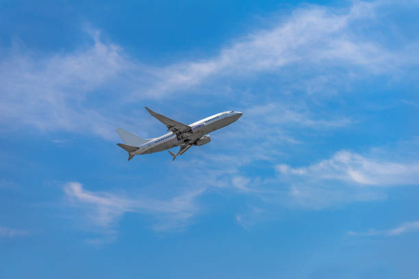 Passenger airplane taking off into the sky Passenger airplane taking off into the sky economy class stock pictures, royalty-free photos & images