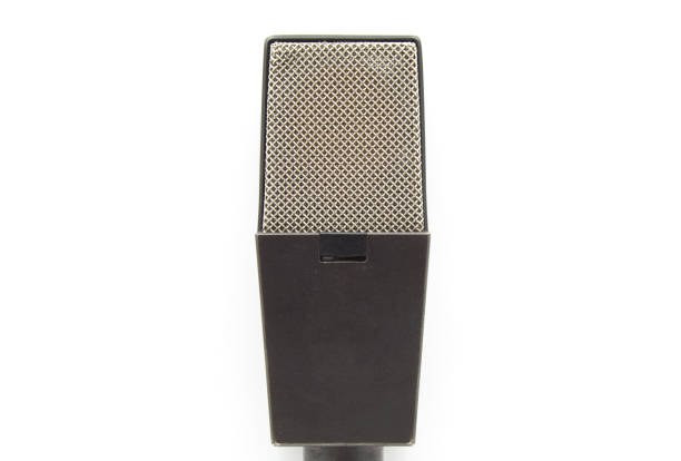 Closeup old retro microphone isolated on white background.
