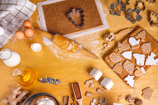 istock Christmas gingerbread different shaped with sugar icing and ingredients for gingerbread, flat lay 1337913143