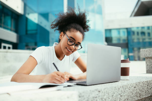 istock African American Student Girl Using Laptop Taking Notes Learning Outdoor 1337915385