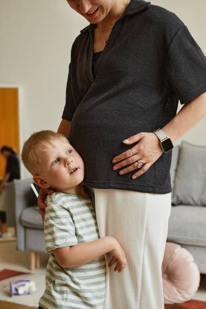 istock Son Talking To Baby In Mothers Belly 1337921604