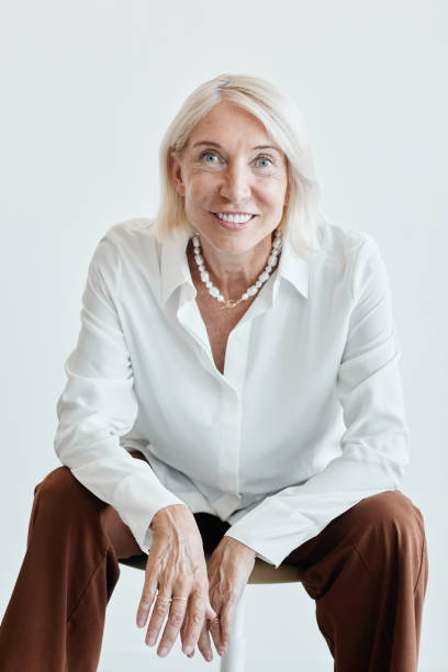 istock Successful Mature Businesswoman on White 1337921746