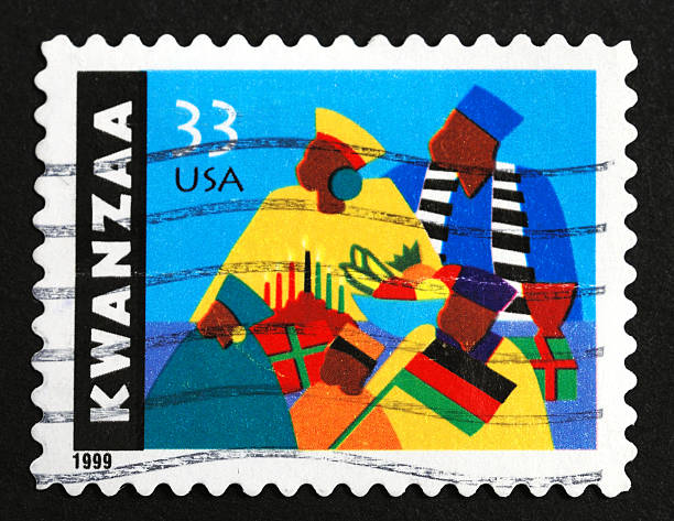 Kwanzaa postage stamp Kwanzaa postage stamp. On black. Kwanzaa is a holiday celebrated over several days after Christmas (December 26 to January 1) in honor of African traditional heritage and culture. Canceled 33 cent USA stamp issued in 1999. postage stamp photos stock pictures, royalty-free photos & images
