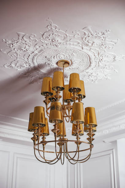 istock Beautiful golden chandelier hanging on the ceiling 1337927177