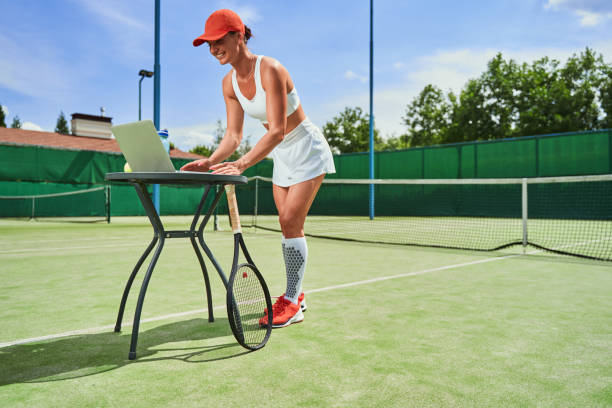 istock Gladsome tennis player chatting online after the game 1337927563