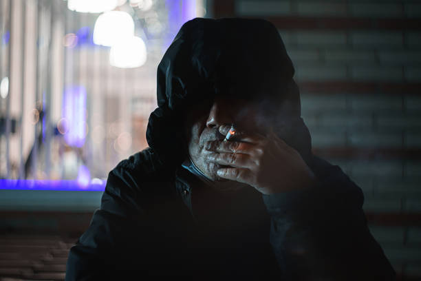 istock Night portrait of a man smoke cigarette. 1337928193