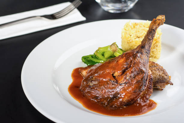 braised lamb shank on the mashed potato on wooden table - lamb shank dinner meal imagens e fotografias de stock