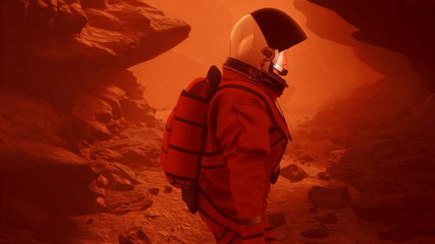 istock Astronaut researcher walks through a sandstorm on the planet Mars. The man was created using 3D computer graphics. 3D rendering 1337930495