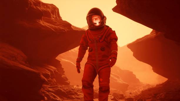 istock Astronaut researcher walks through a sandstorm on the planet Mars. The man was created using 3D computer graphics. 3D rendering 1337930497