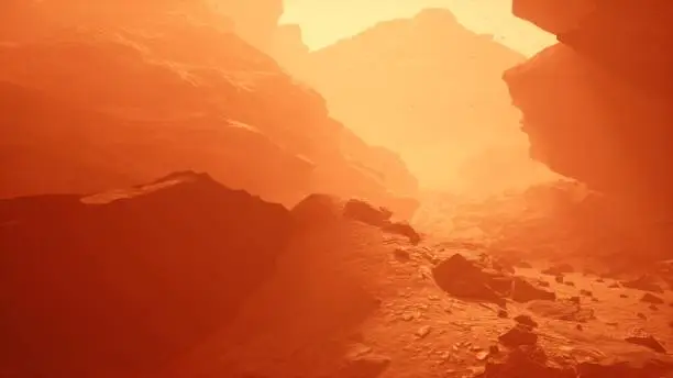 The surface of the red planet Mars during a dusty sandstorm. Mars colonization and space travel concept. The image is designed for futuristic, sci-fi or space travel. View of the Martian surface.