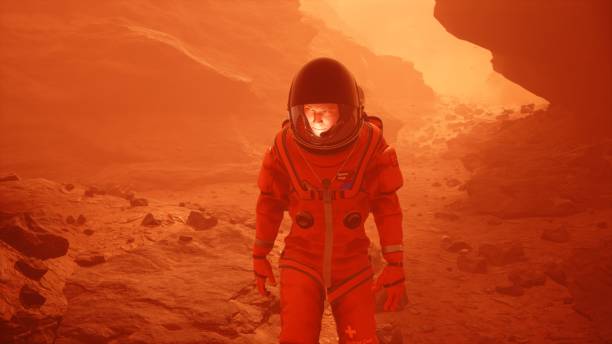 istock Astronaut researcher walks through a sandstorm on the planet Mars. The man was created using 3D computer graphics. 3D rendering 1337930524