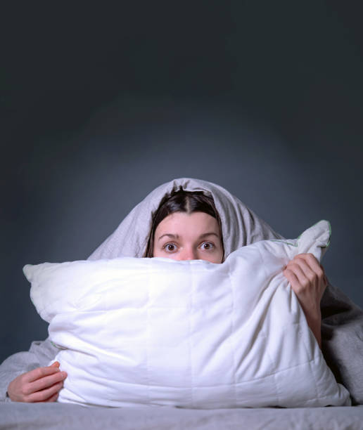 istock A young girl lies in bed and cannot sleep 1337932167