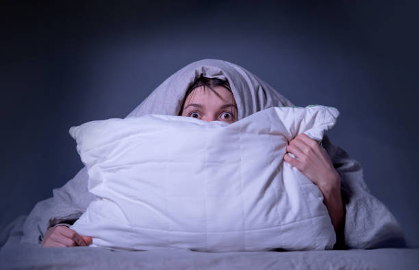 istock A young girl lies in bed and cannot sleep 1337932215