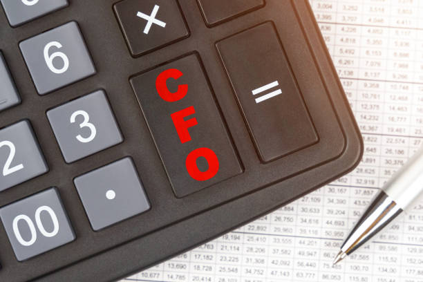 On the table is a report, a pen and a calculator, on the big key of which is written - CFO Business and finance. On the table is a report, a pen and a calculator, on the big key of which is written - CFO cfo stock pictures, royalty-free photos & images