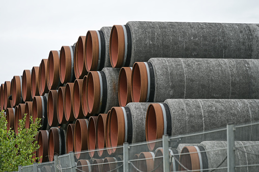 Pipes for the controversial north stream 2 gas pipeline stacked at the port of Sassnitz on Rugen in Mecklenburg-Western Pomerania, Germany, selected focus