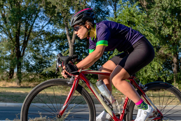 istock Female cyclist riding a bicycle outdoors. 1337936587