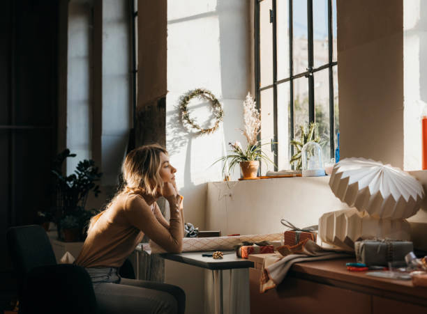 Beautiful Woman Looking Through Window