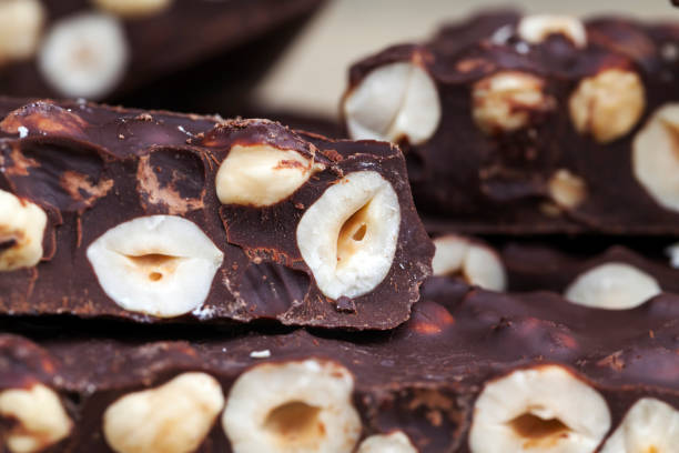 istock milk chocolate with whole and chunks of hazelnuts 1337938714