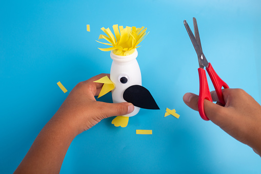 easy plastic yogurt bottle craft, DIY, preschool activity, funny abstract penguin toy