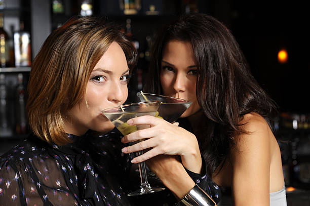 istock Two Young Women Drinking Martinis in Bar 133794257