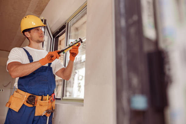 istock Handsome male builder fixing window in apartment 1337944342