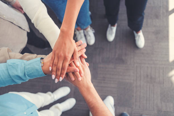 istock Group of multi ethnic business people celebrating. 1337949638