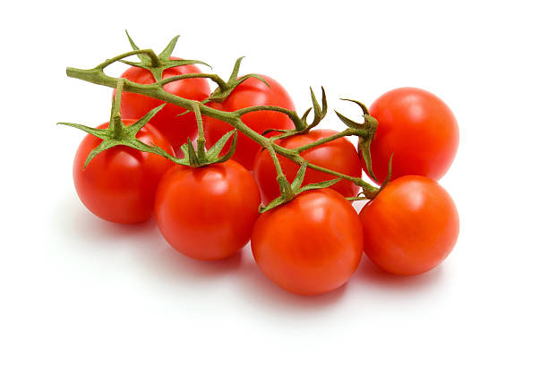 Freshly picked cherry tomatoes on a branch Ripe Fresh Cherry Tomatoes on Branch Isolated on White cherry tomato stock pictures, royalty-free photos & images