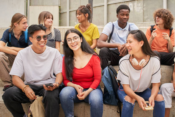 istock Group of multi-ethnic students happily looking at the camera during a break. 1337952263