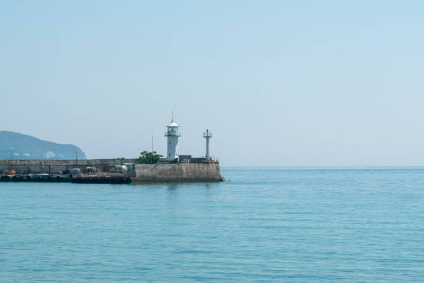 istock lighthouse on the pier during the day 1337953874
