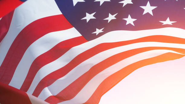 istock USA flag on a background of blue sky. National holidays concept 1337972767