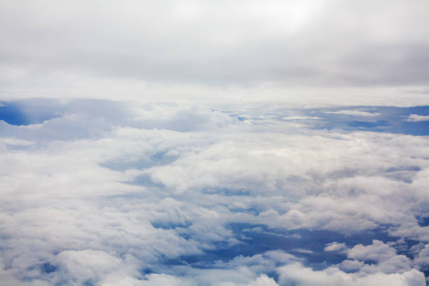 istock White clouds on blue sky background view from above, airplane flight landscape, beautiful aerial cloudscape, skies backdrop, fluffy cloud texture, sunny heaven, cloudy weather, cloudiness, copy space 1337974772