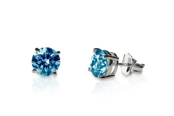 Beautiful blue topaz diamond gemstone earrings fine jewelry with lots of sparkle isolated on a white background