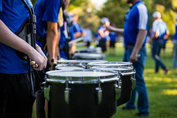 Drum-line Warm Up - Marching Band A marching band and drum line prepare to perform. drum percussion instrument photos stock pictures, royalty-free photos & images