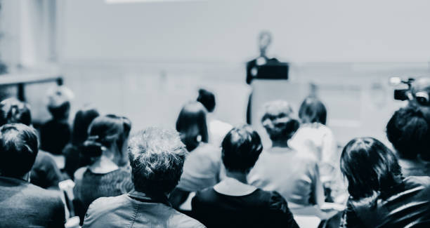 istock Woman giving presentation on a business conference. 1337988584